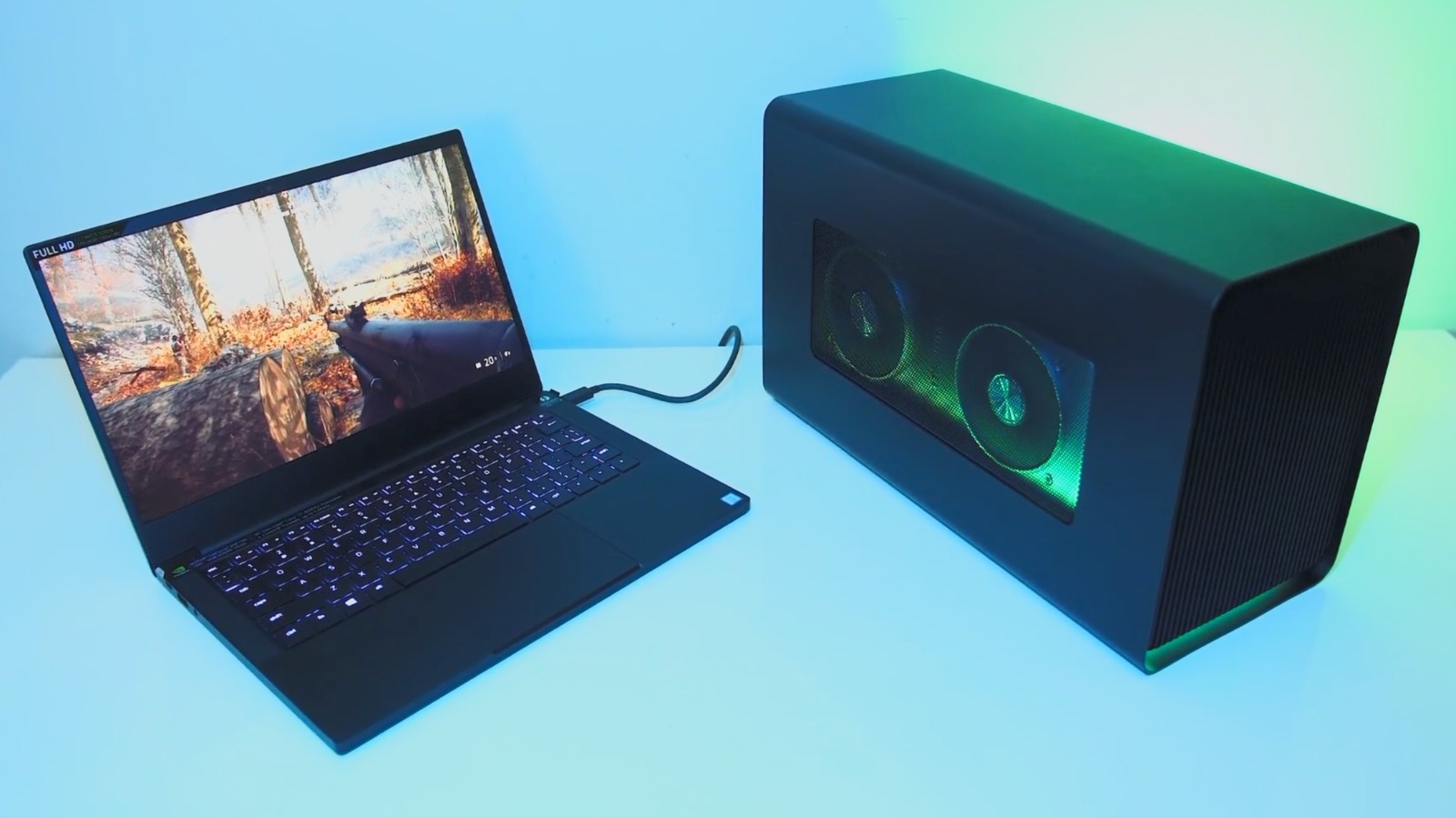 An external desktop graphics card enclosure connected to a laptop.