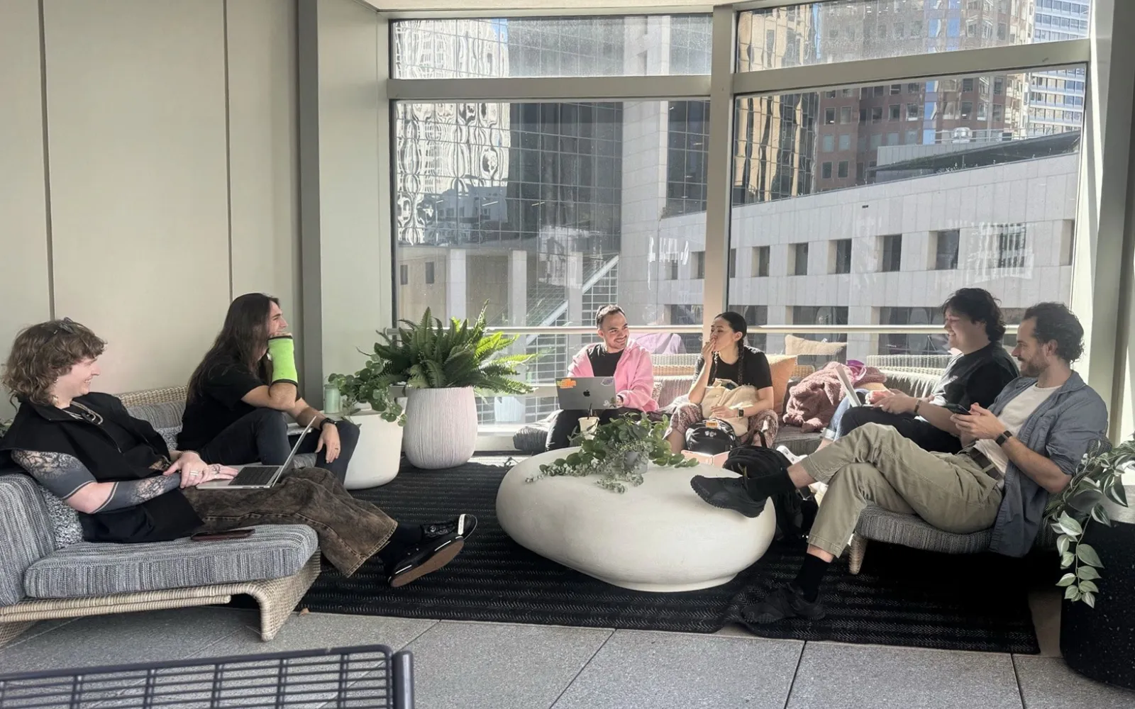 TypeSafe CEO Diogo Almeida sits with members of the company's team in a San Francisco office.