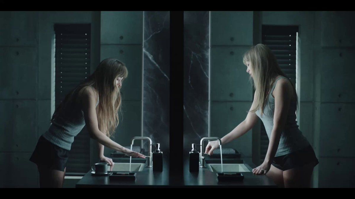 Taylor Swift stands beside her reflection in the “Patient Zero” video.