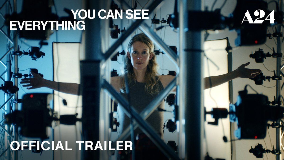 Elizabeth Holmes surrounded by cameras in the official trailer art for You Can See Everything