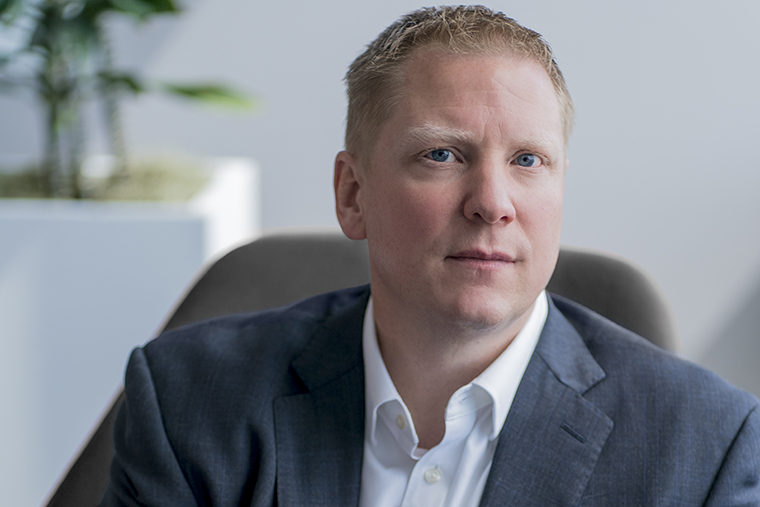 Scott Wilson, chief investment officer for Washington University in St. Louis, seated in an office.