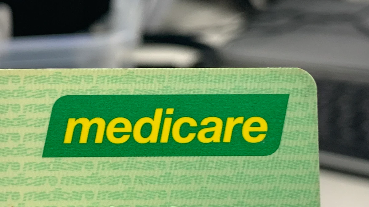 Close-up of the Medicare logo on an Australian Medicare card.