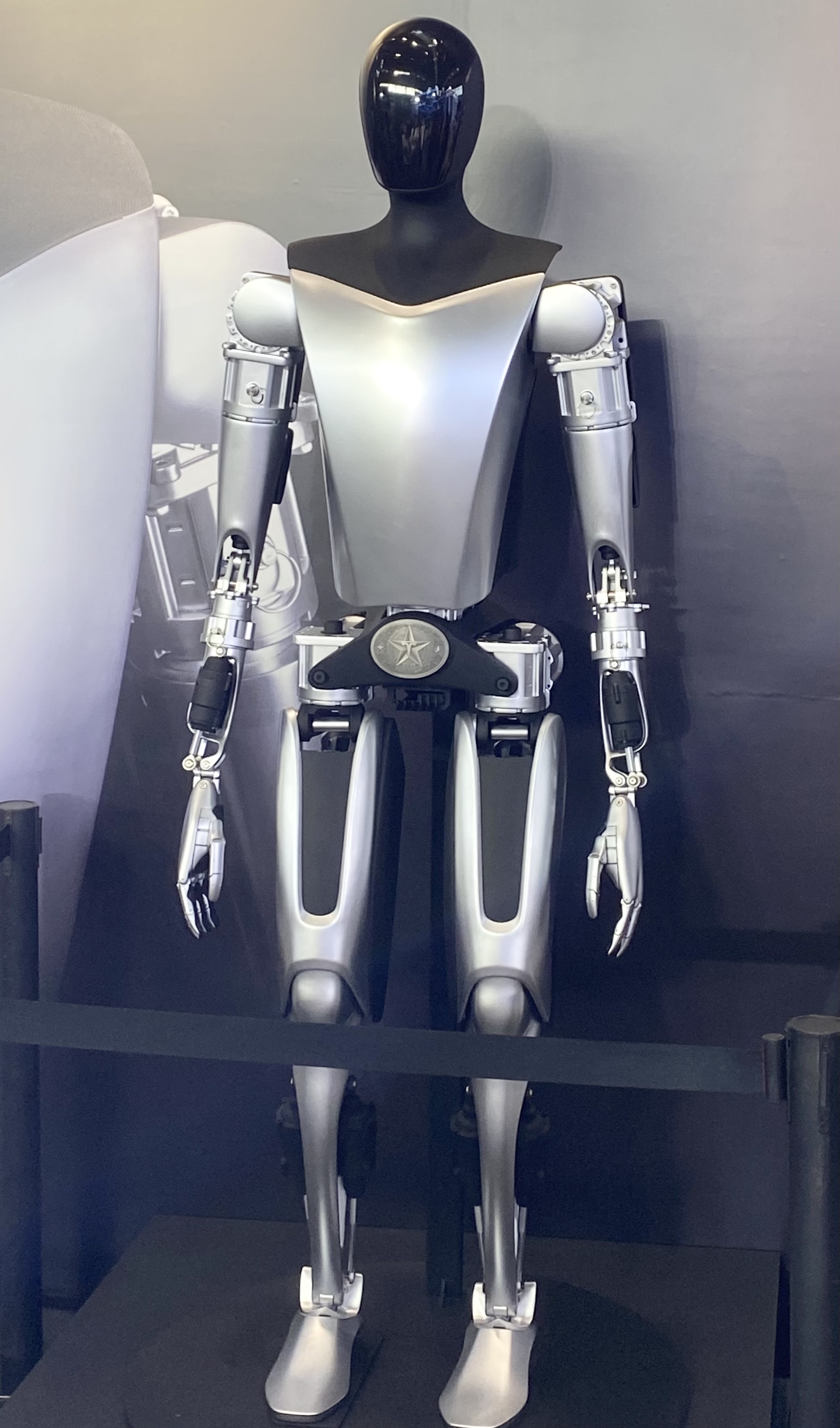 Tesla Optimus robot displayed at an exhibition.