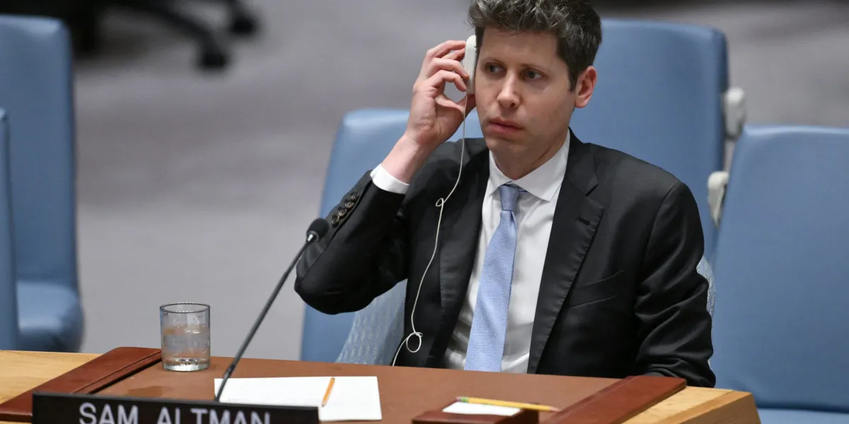 OpenAI CEO Sam Altman listens through an earpiece at a United Nations meeting.
