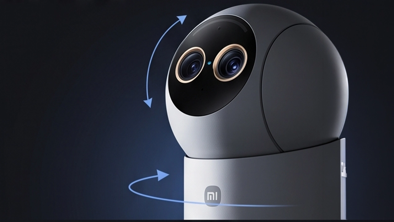 Xiaomi's dual-lens indoor camera shown against a dark blue background.