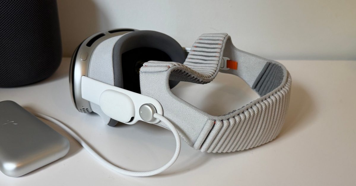 Apple Vision Pro headset displayed against a dark background.