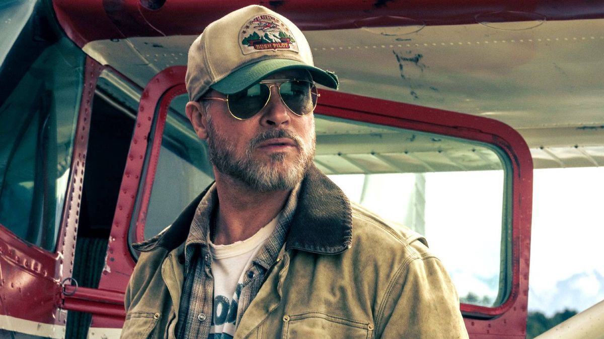 Brad Pitt wearing sunglasses and a cap in Heart of the Beast