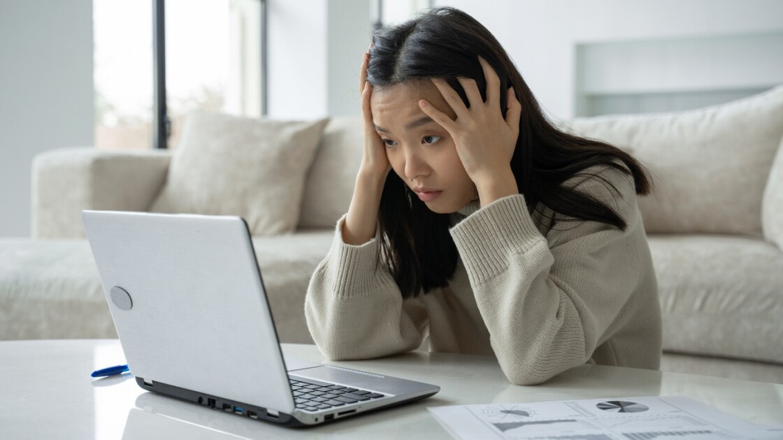 Laptop displaying a frozen or unresponsive computer screen.