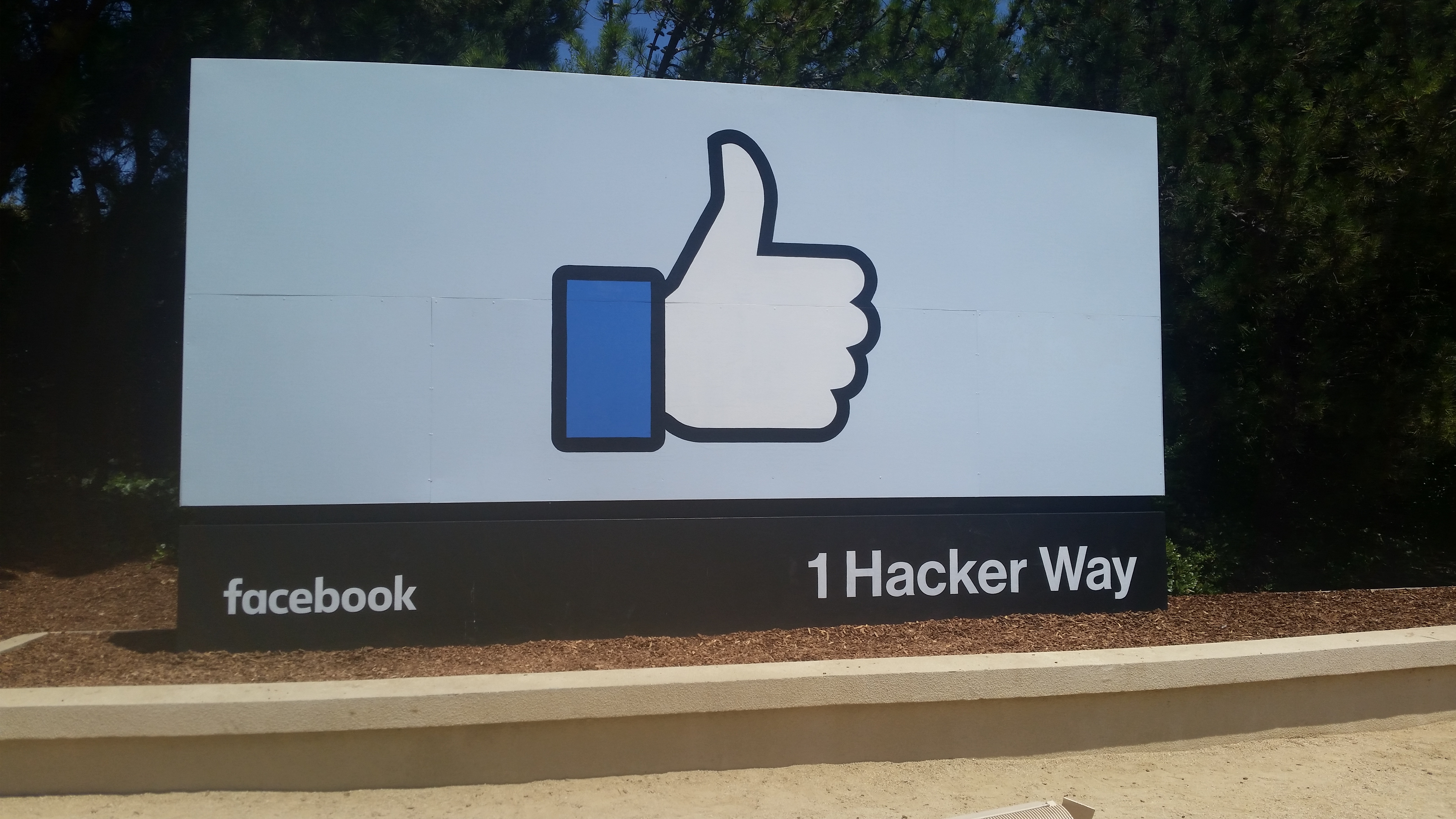 Facebook headquarters entrance sign at 1 Hacker Way in Menlo Park, California.