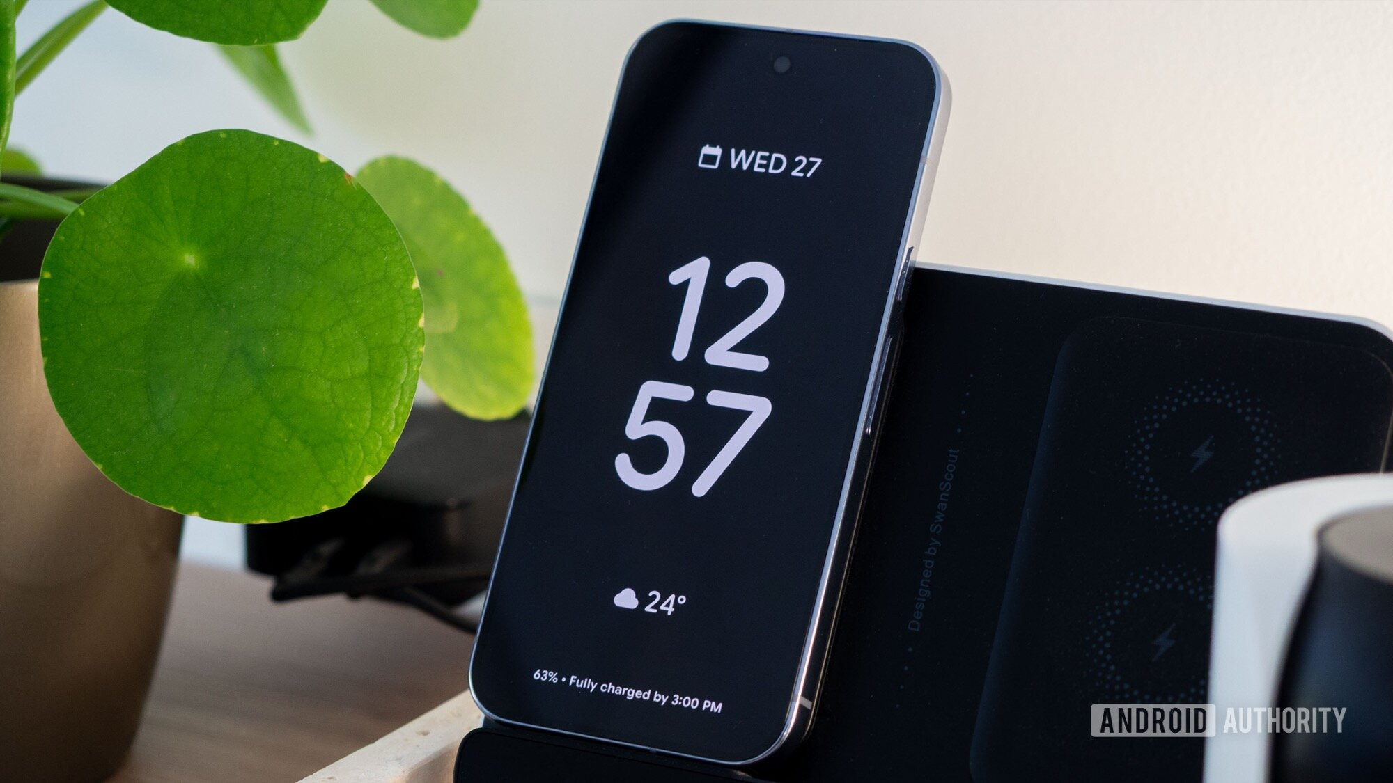 A Google Pixel 10 Pro displays a digital clock on its screen.