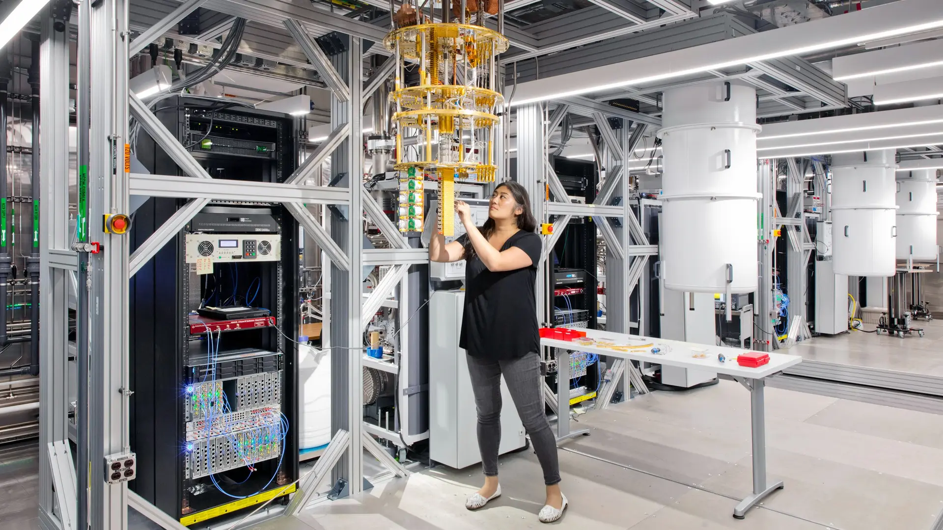 A researcher works beside cryogenic equipment in IBM’s quantum computing laboratory.