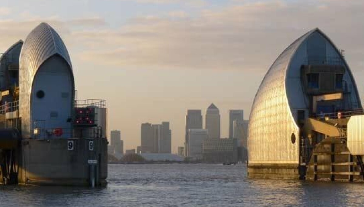 London buildings beside the Thames in reporting on planned waste-heat networks.