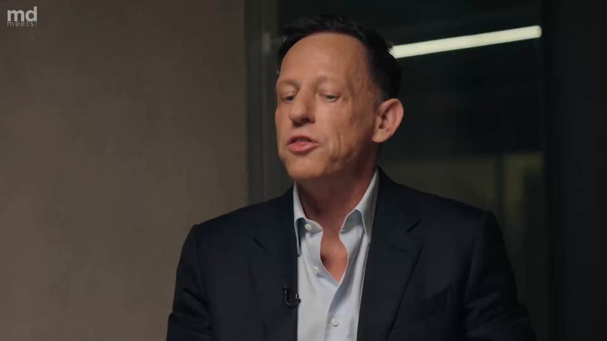 Peter Thiel speaking with Mathias Döpfner during an interview.