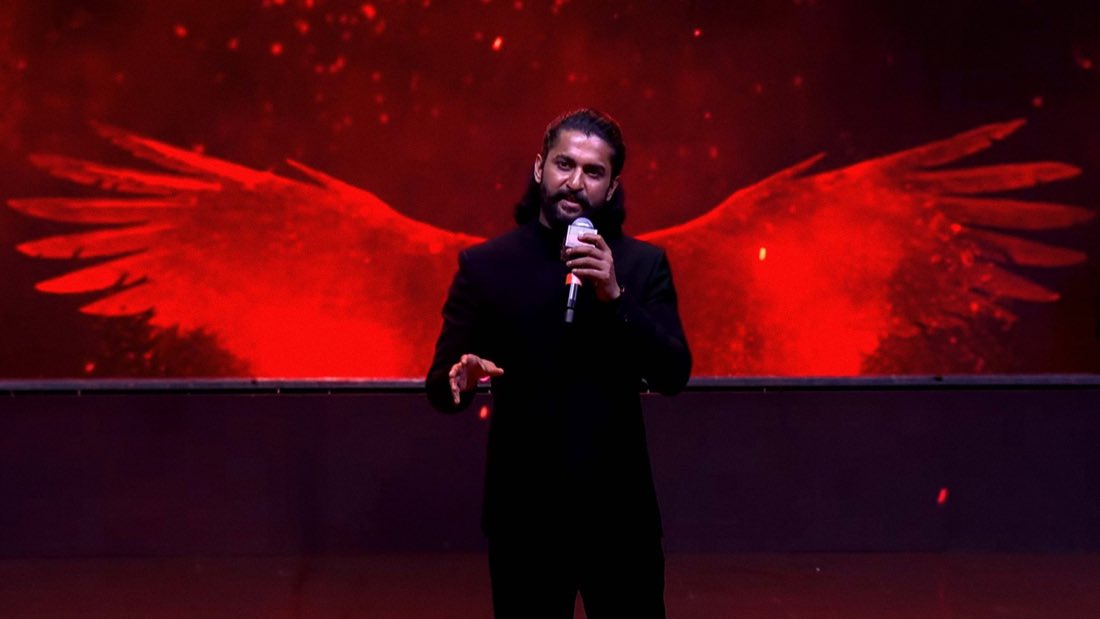 A speaker onstage at an event for The Paradise
