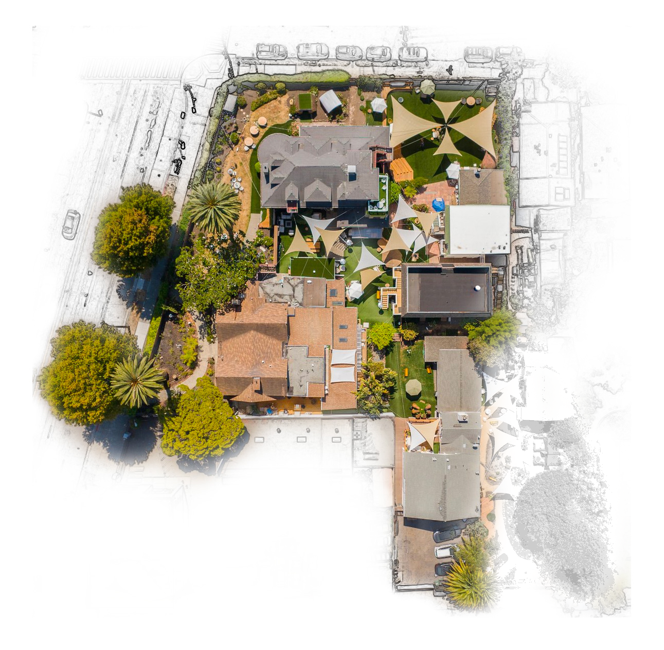 An aerial view of the Lighthaven campus in Berkeley, with buildings, lawns and event canopies.